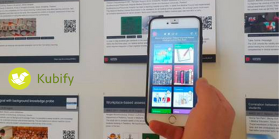 Image of a phone app in front of a poster wall at an event. Done for Kubify.